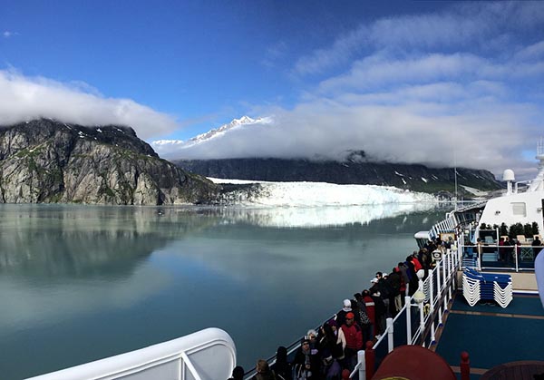 Cruise passengers take in the Alaskan scenery from their ship.