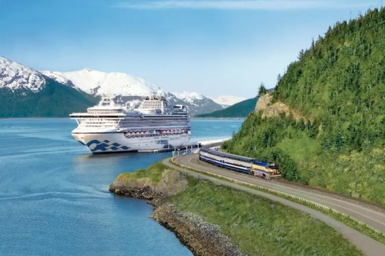 Alaska cruise deal showcasing a ship navigating through glacier-lined fjords with views of snow-capped mountains, icy waters, and pristine wilderness landscapes