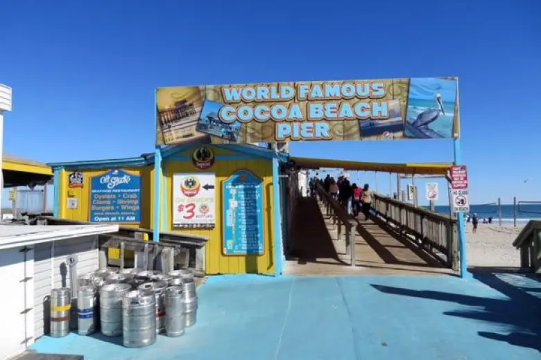 Port Canaveral cruise deal showcasing a ship departing Florida’s Space Coast with views of sandy beaches, palm trees, and nearby Kennedy Space Center